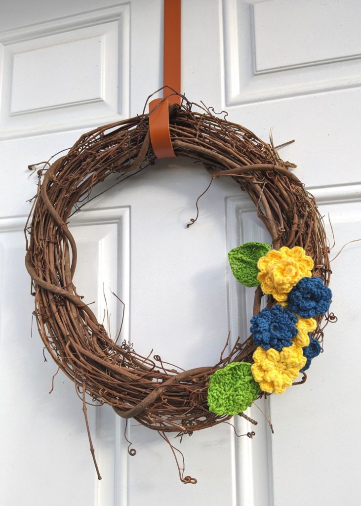 stick wreath with crocheted flowers